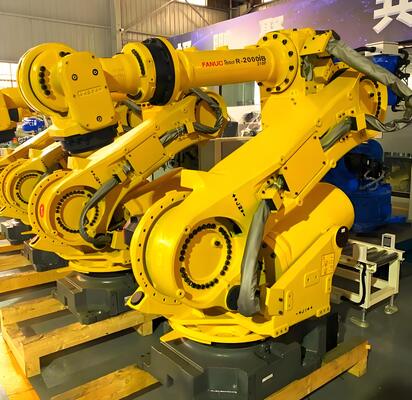 Célula de corte a laser FANUC com carga/descarga automática e mesa giratória para produção em massa de peças metálicas 3D na indústria automotiva