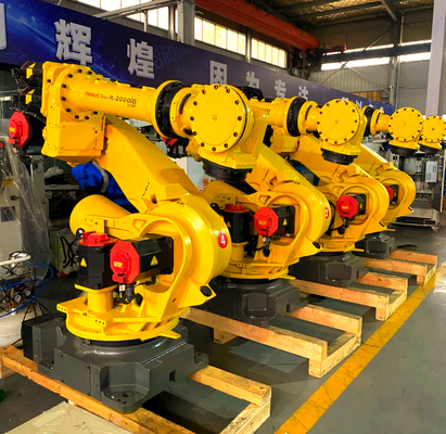 Célula de corte a laser FANUC com carga/descarga automática e mesa giratória para produção em massa de peças metálicas 3D na indústria automotiva